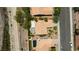 Aerial view of a well-maintained property with a pool, landscaped yard, and desert landscaping at 1803 Candle Bright Dr, Henderson, NV 89074