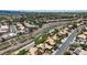 Expansive aerial shot of a desert neighborhood, featuring lush trees and desert landscaping at 1803 Candle Bright Dr, Henderson, NV 89074