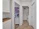 Bright hallway featuring a bathroom and decorated bedroom on either side at 1803 Candle Bright Dr, Henderson, NV 89074