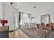 Inviting living room and dining area filled with natural light, modern decor, and comfortable seating at 1803 Candle Bright Dr, Henderson, NV 89074