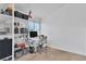 Bright home office space with built-in shelves, modern desk, and comfortable chair at 1803 Candle Bright Dr, Henderson, NV 89074