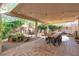 Covered patio featuring an oversized dining table with chairs, great for outdoor gatherings and dining at 1803 Candle Bright Dr, Henderson, NV 89074