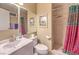 Bright bathroom featuring a standup shower, vanity with sink, toilet, and tiled floors at 2045 S Tenaya Way, Las Vegas, NV 89117
