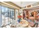 Charming breakfast nook with sliding glass doors offering bright natural light and view to the backyard at 2045 S Tenaya Way, Las Vegas, NV 89117
