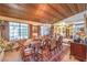 Well-lit dining room with wood ceiling, shuttered windows and traditional furnishings at 2045 S Tenaya Way, Las Vegas, NV 89117