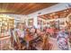 Spacious dining area featuring wooden ceiling and traditional décor leading to other living spaces at 2045 S Tenaya Way, Las Vegas, NV 89117