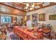 Spacious room with a wood ceiling featuring a ceiling mirror detail, adjacent to the kitchen at 2045 S Tenaya Way, Las Vegas, NV 89117