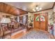 Elegant dining room featuring a wood ceiling, hardwood floors, and stained-glass double entry doors at 2045 S Tenaya Way, Las Vegas, NV 89117