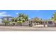 Charming home featuring mature landscaping, long driveway, carport, and privacy fence at 2045 S Tenaya Way, Las Vegas, NV 89117
