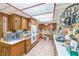 Functional kitchen features classic wood cabinetry and built-in appliances for efficient cooking at 2045 S Tenaya Way, Las Vegas, NV 89117