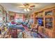 A cozy living room is filled with decor and features a ceiling fan at 2045 S Tenaya Way, Las Vegas, NV 89117