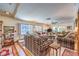 Cozy living room with plush seating, shutters, and multi-level platform floor at 2045 S Tenaya Way, Las Vegas, NV 89117