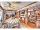 Bright and airy living room with wood floors, brick features and an open-concept design at 2045 S Tenaya Way, Las Vegas, NV 89117