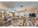 Relaxing living room filled with natural light from shuttered windows and comfortable seating arrangements at 2045 S Tenaya Way, Las Vegas, NV 89117