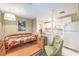 Cozy living space with a kitchenette features a daybed and ample natural light, creating a comfortable and inviting atmosphere at 2045 S Tenaya Way, Las Vegas, NV 89117