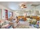 This main bedroom features lots of natural light, mirrored wall and ceiling fan at 2045 S Tenaya Way, Las Vegas, NV 89117