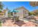 Outdoor patio with brick pavers and multiple seating areas offers a relaxing space for enjoying the backyard at 2045 S Tenaya Way, Las Vegas, NV 89117