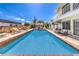 Sparkling pool surrounded by brick coping and ample deck space, ideal for summertime fun and relaxation at 2045 S Tenaya Way, Las Vegas, NV 89117