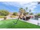 The backyard has a beautiful pool, patio area, and mature landscaping at 2144 Paganini Ave, Henderson, NV 89052