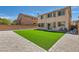 Backyard featuring green turf, low maintenance gravel and perimeter block wall at 216 Sharp Edge Ave, North Las Vegas, NV 89031