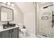 This renovated bathroom features a walk-in shower with rainfall shower head, and vessel sink at 216 Sharp Edge Ave, North Las Vegas, NV 89031