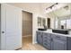 Bathroom featuring double vanity and closet access at 216 Sharp Edge Ave, North Las Vegas, NV 89031