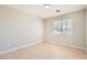 Bright bedroom featuring natural light, with wood-look flooring and neutral walls at 216 Sharp Edge Ave, North Las Vegas, NV 89031