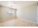 Bright bedroom featuring natural light, with wood-look flooring and neutral walls at 216 Sharp Edge Ave, North Las Vegas, NV 89031