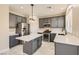 Stylish kitchen featuring gray cabinets, stainless steel appliances, and a functional center island at 216 Sharp Edge Ave, North Las Vegas, NV 89031