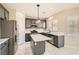 Modern kitchen with gray cabinetry, stainless steel appliances, and a center island at 216 Sharp Edge Ave, North Las Vegas, NV 89031