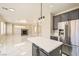 Contemporary kitchen with gray cabinets, stainless steel appliances, and an open layout at 216 Sharp Edge Ave, North Las Vegas, NV 89031