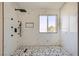 Modern shower featuring mosaic floors and a rainfall shower head at 216 Sharp Edge Ave, North Las Vegas, NV 89031