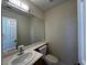 Convenient half bathroom with a vanity and toilet at 2419 Pebble Springs Ct, Henderson, NV 89074