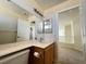 Bathroom featuring a modern vanity, framed mirrors, and a view to the second floor at 2419 Pebble Springs Ct, Henderson, NV 89074