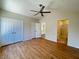 Large bedroom with vaulted ceilings, ceiling fan, hardwood floors, and access to the bathroom at 2419 Pebble Springs Ct, Henderson, NV 89074