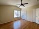 Large bedroom featuring hardwood floors, vaulted ceiling, ceiling fan, and ample closet space at 2419 Pebble Springs Ct, Henderson, NV 89074