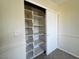 Bedroom features a closet with sliding doors and built-in shelving for optimal organization at 2419 Pebble Springs Ct, Henderson, NV 89074