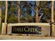 Pebble Creek community sign with trees, landscaping, and stone features creating an attractive neighborhood entrance at 2419 Pebble Springs Ct, Henderson, NV 89074