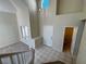 Spacious entryway featuring high ceilings, tile flooring, and access to a half bathroom at 2419 Pebble Springs Ct, Henderson, NV 89074