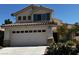 Attractive two-story home with a spacious two-car garage and desert-friendly landscaping at 2419 Pebble Springs Ct, Henderson, NV 89074