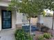 Inviting front entrance framed by lush landscaping, providing a serene ambiance and enhancing the home's curb appeal at 2419 Pebble Springs Ct, Henderson, NV 89074