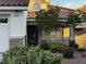 Inviting front entrance with meticulously manicured desert landscaping, creating a warm welcome for guests and showcasing desert charm at 2419 Pebble Springs Ct, Henderson, NV 89074