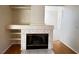 Beautiful fireplace with marble tile surround and built-in shelves adds character to this living room at 2419 Pebble Springs Ct, Henderson, NV 89074