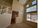 Bright living space featuring tall windows and neutral walls at 2419 Pebble Springs Ct, Henderson, NV 89074