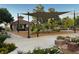 Well-equipped playground featuring a covered pavilion, slide, and various play structures in a Gathering-friendly park at 2419 Pebble Springs Ct, Henderson, NV 89074