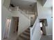 Elegant staircase leading to the second floor, complementing the home's open layout at 2419 Pebble Springs Ct, Henderson, NV 89074