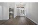 Bright entryway with hardwood flooring, white walls and trim, and a front door with transom window at 2420 Desert Butte Dr, Las Vegas, NV 89134