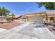 Single story home featuring a two car garage, desert landscaping and a tile roof at 2420 Desert Butte Dr, Las Vegas, NV 89134