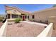 Inviting front exterior with desert landscaping, tiled roof, and a glimpse of the red front door at 2420 Desert Butte Dr, Las Vegas, NV 89134