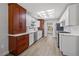 Bright updated kitchen with white and wood cabinets, marble countertops, and stainless steel appliances at 2420 Desert Butte Dr, Las Vegas, NV 89134